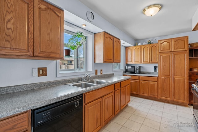 kitchen with sink, light tile patterned floors, and black appliances