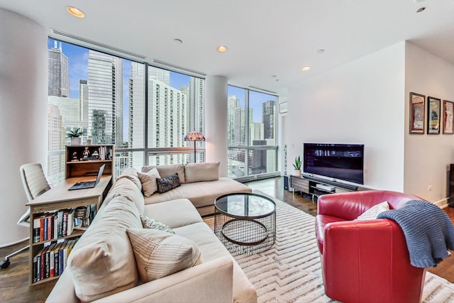 living room featuring hardwood / wood-style flooring and a wall of windows