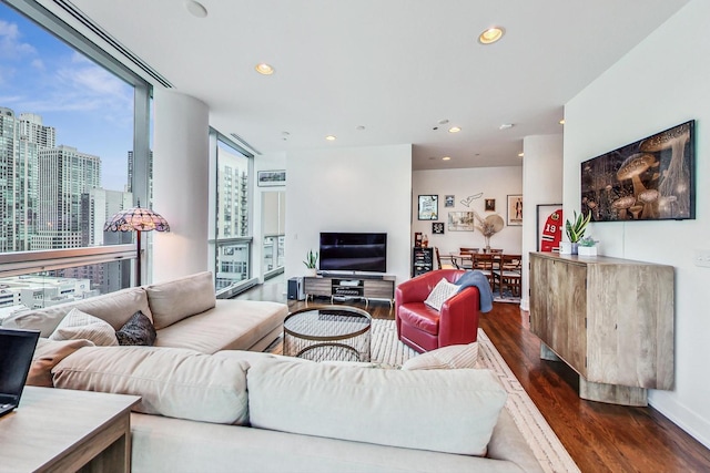 living room with expansive windows and dark hardwood / wood-style floors