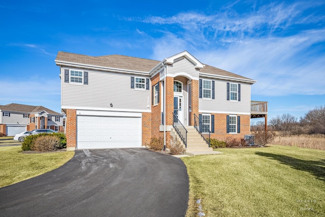 view of front facade featuring a garage and a front lawn