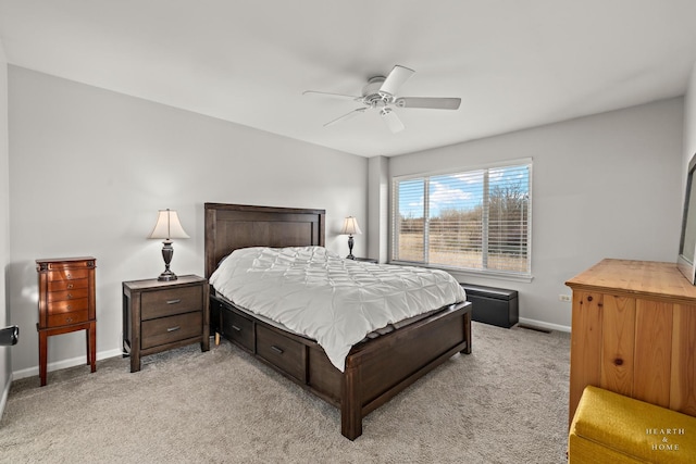 bedroom with ceiling fan and light colored carpet