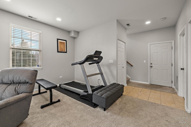 workout room with light tile patterned floors