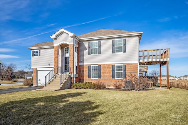 view of front facade featuring a garage and a front lawn