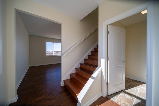 staircase featuring hardwood / wood-style floors