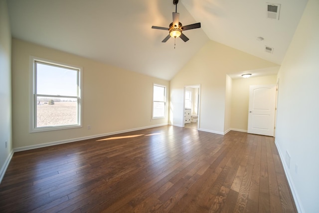 unfurnished living room with lofted ceiling, dark wood-type flooring, and ceiling fan