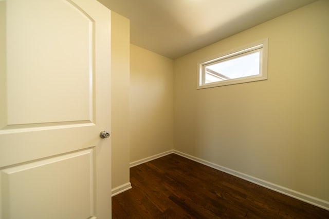 empty room with dark hardwood / wood-style floors