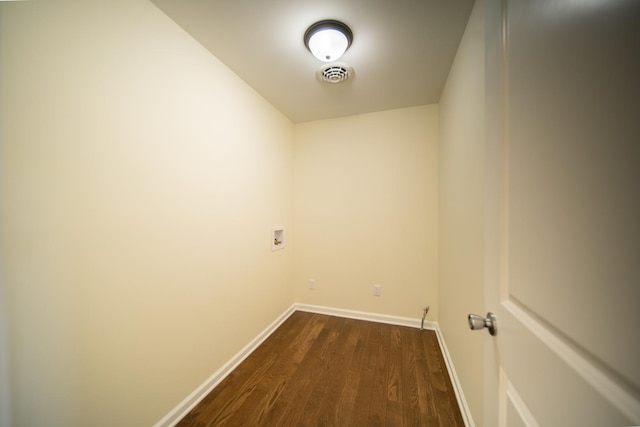 washroom featuring hookup for a washing machine and dark wood-type flooring