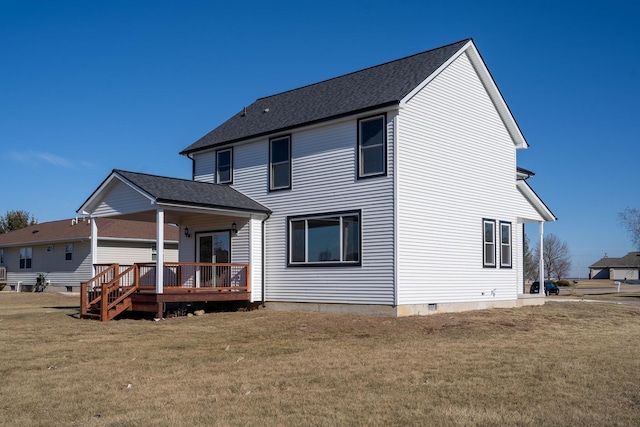 back of house with a lawn and a deck