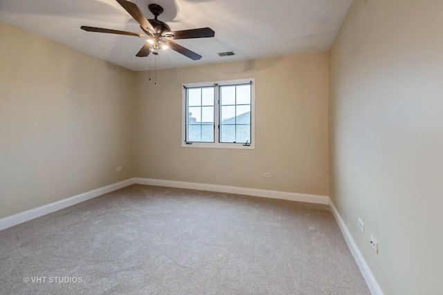 carpeted empty room with ceiling fan