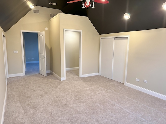 additional living space featuring vaulted ceiling, light colored carpet, and ceiling fan