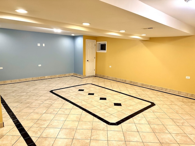 basement with basketball court and light tile patterned floors