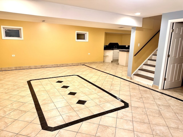 basement featuring light tile patterned flooring