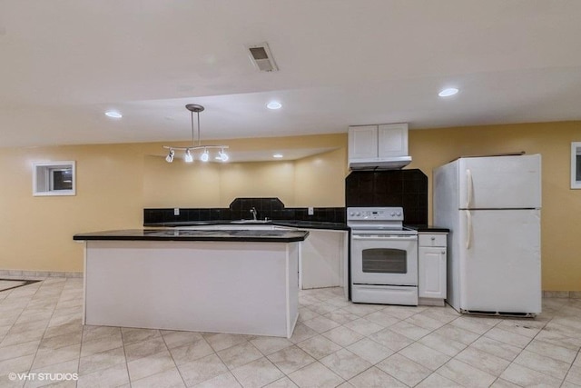 kitchen with pendant lighting, sink, white appliances, light tile patterned floors, and white cabinetry