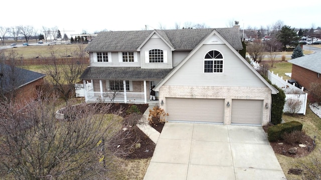 view of front of home featuring a garage and a porch