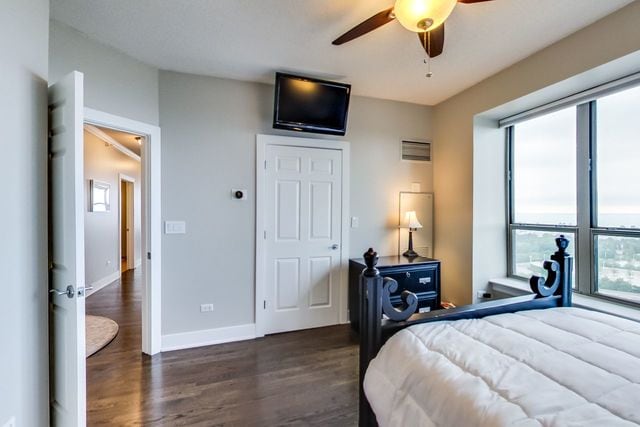 bedroom featuring dark wood-type flooring and ceiling fan