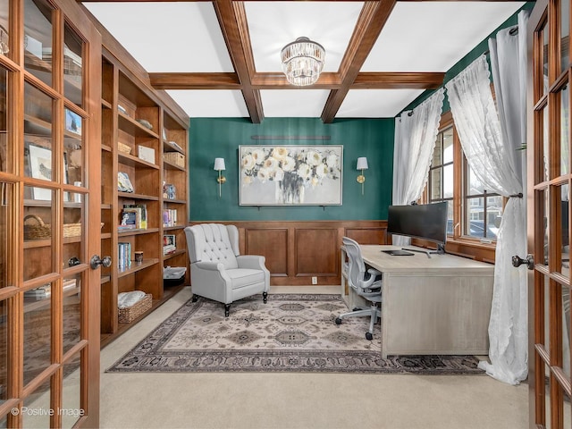 office space featuring coffered ceiling, a chandelier, french doors, and beamed ceiling