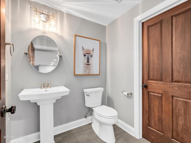 bathroom with toilet and sink