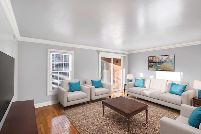 living room featuring hardwood / wood-style flooring and crown molding