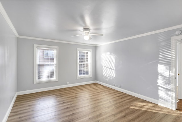 empty room featuring wood-type flooring, ornamental molding, and ceiling fan