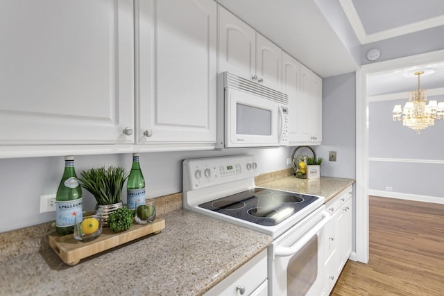 kitchen with white appliances, crown molding, white cabinetry, a notable chandelier, and light wood-type flooring