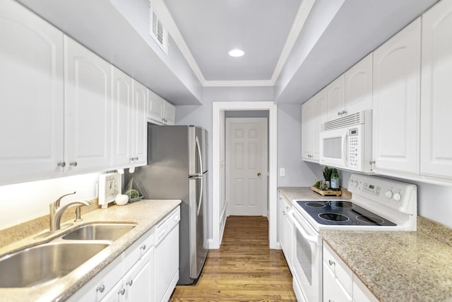 kitchen with white cabinetry, sink, light hardwood / wood-style floors, crown molding, and white appliances