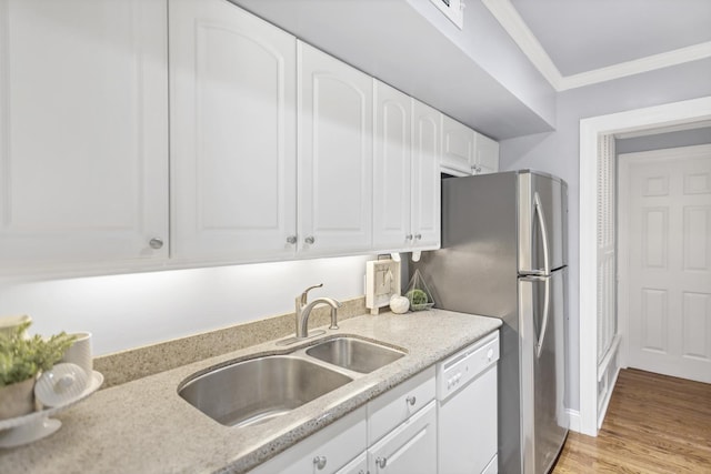 kitchen with sink, ornamental molding, dishwasher, light hardwood / wood-style floors, and white cabinets