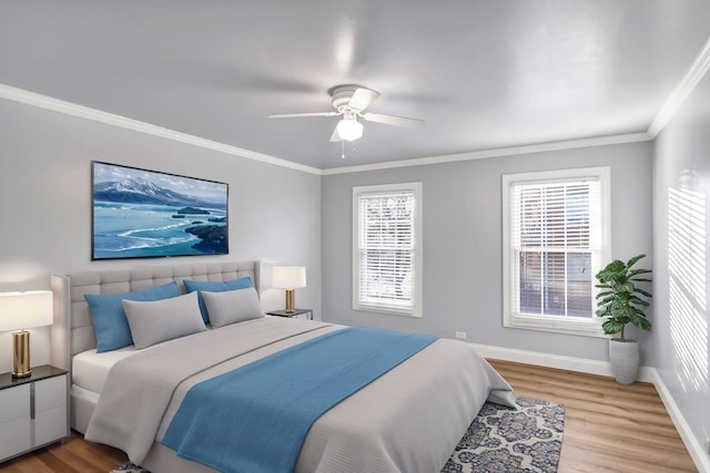 bedroom with light hardwood / wood-style flooring, ornamental molding, and ceiling fan