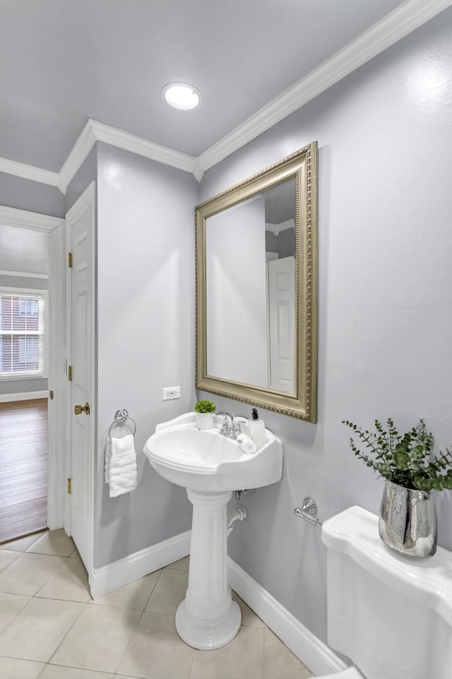 bathroom featuring crown molding and tile patterned floors