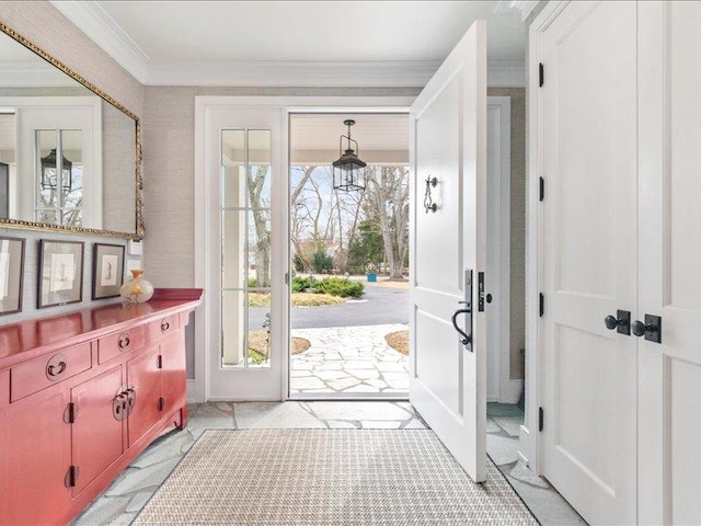 entryway featuring ornamental molding