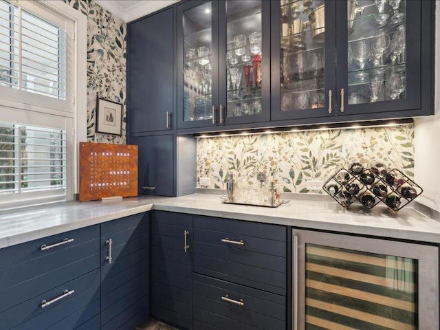 bar with wine cooler, backsplash, and a dry bar