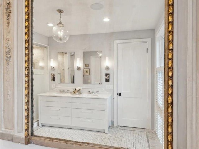 bathroom with double vanity and a sink