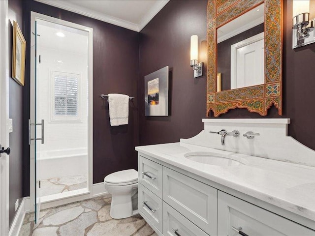 bathroom with toilet, baseboards, ornamental molding, and vanity