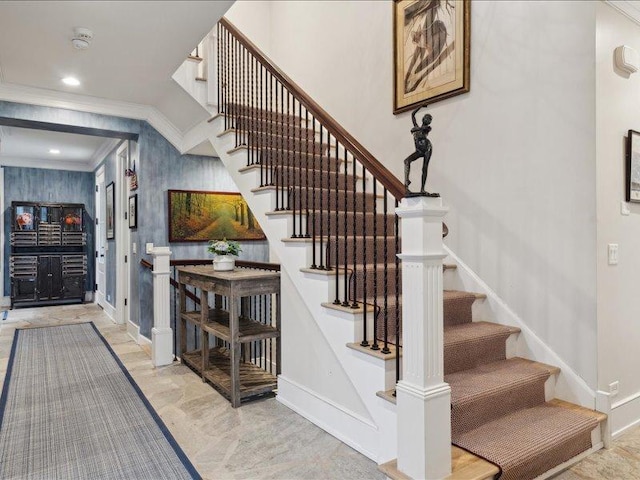 staircase with baseboards, crown molding, and recessed lighting