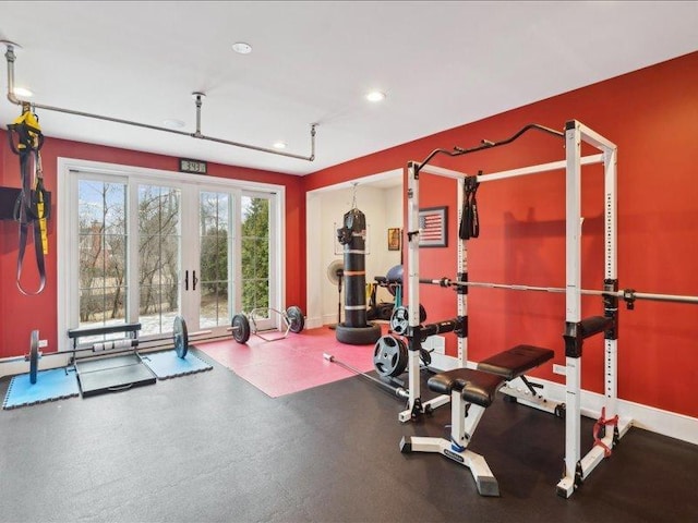 exercise room featuring baseboards and recessed lighting