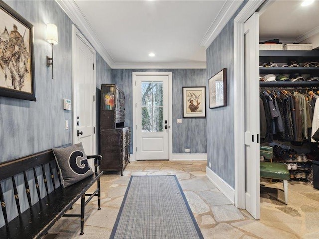 entrance foyer featuring recessed lighting, stone finish floor, crown molding, and baseboards