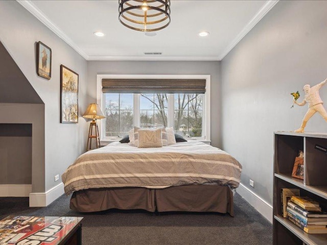 bedroom with baseboards, visible vents, carpet flooring, and ornamental molding