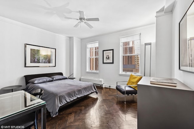 bedroom with crown molding, dark parquet floors, and ceiling fan