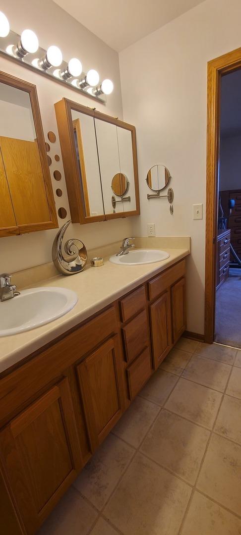 bathroom featuring vanity and tile patterned flooring