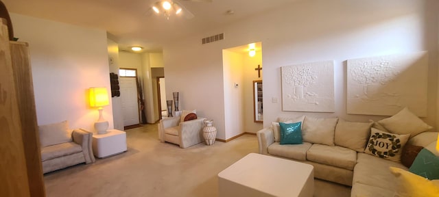 carpeted living room featuring ceiling fan