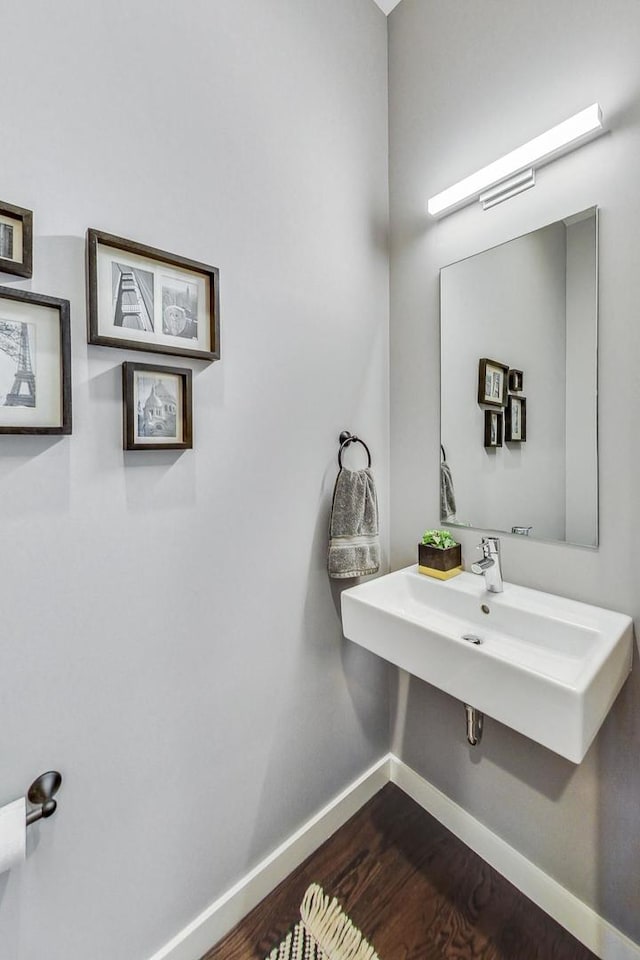 bathroom featuring sink and hardwood / wood-style flooring