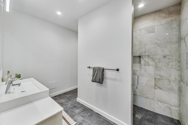 bathroom featuring sink, tile patterned floors, and a shower with shower door