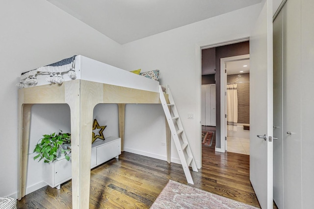 bedroom featuring dark hardwood / wood-style floors