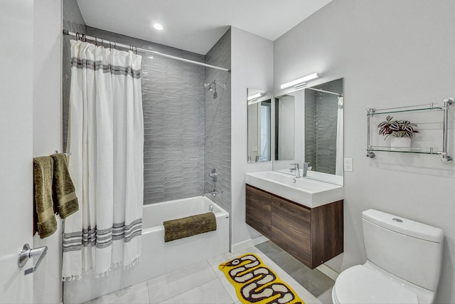 full bathroom featuring vanity, shower / tub combo, tile patterned floors, and toilet