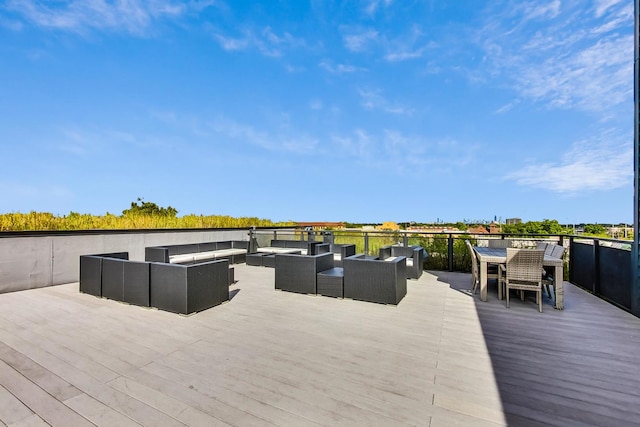 wooden terrace with outdoor lounge area