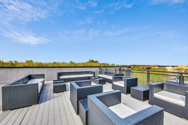 wooden terrace with an outdoor hangout area