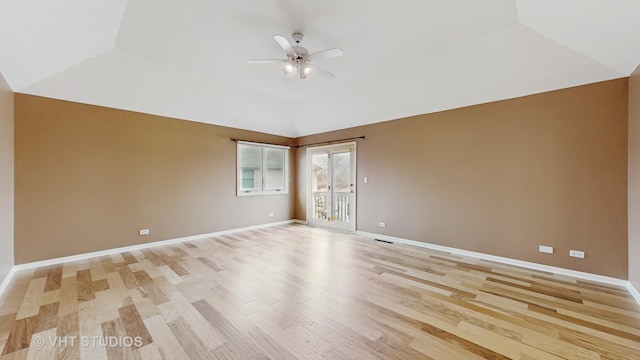 spare room featuring lofted ceiling, ceiling fan, and light hardwood / wood-style flooring