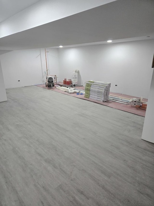 basement featuring hardwood / wood-style floors