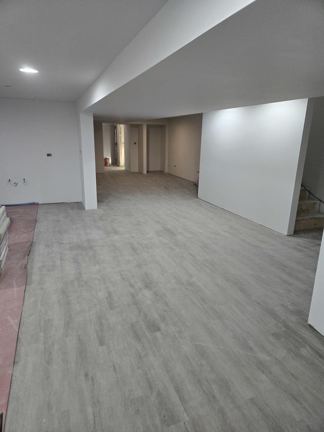 basement featuring hardwood / wood-style floors