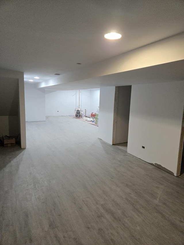 basement featuring hardwood / wood-style floors