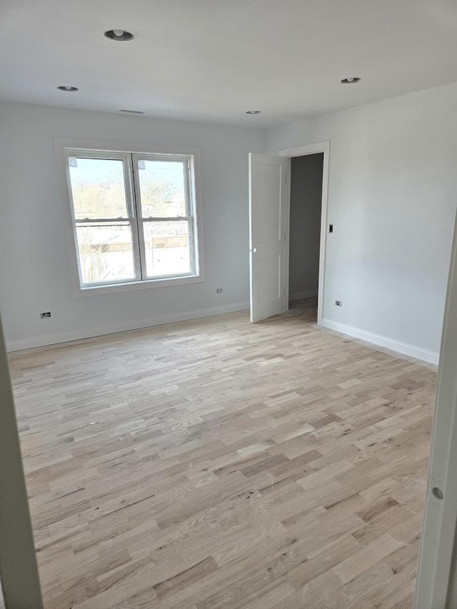 unfurnished room featuring light hardwood / wood-style flooring